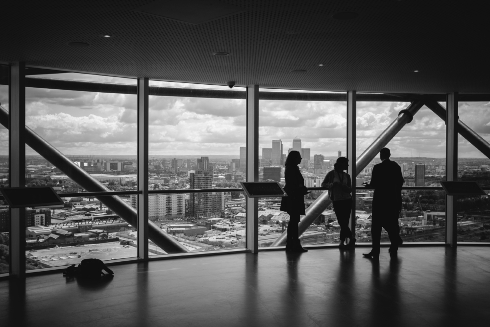 Black and white photo of leadership in company helping other foundations