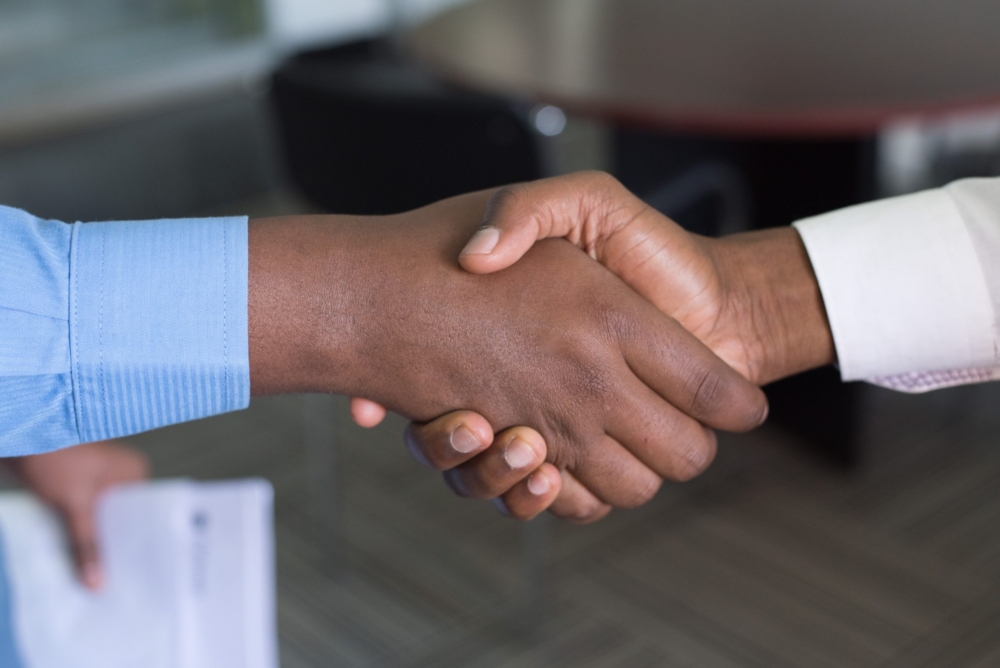 Firm Handshake Between 2 Guys - Collaborative Consulting